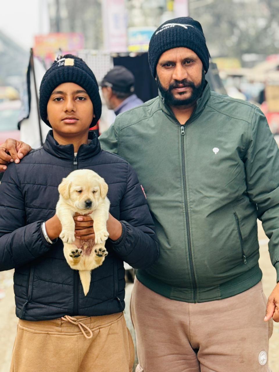 Customer receiving vet-certified puppy from Kharoud Kennel