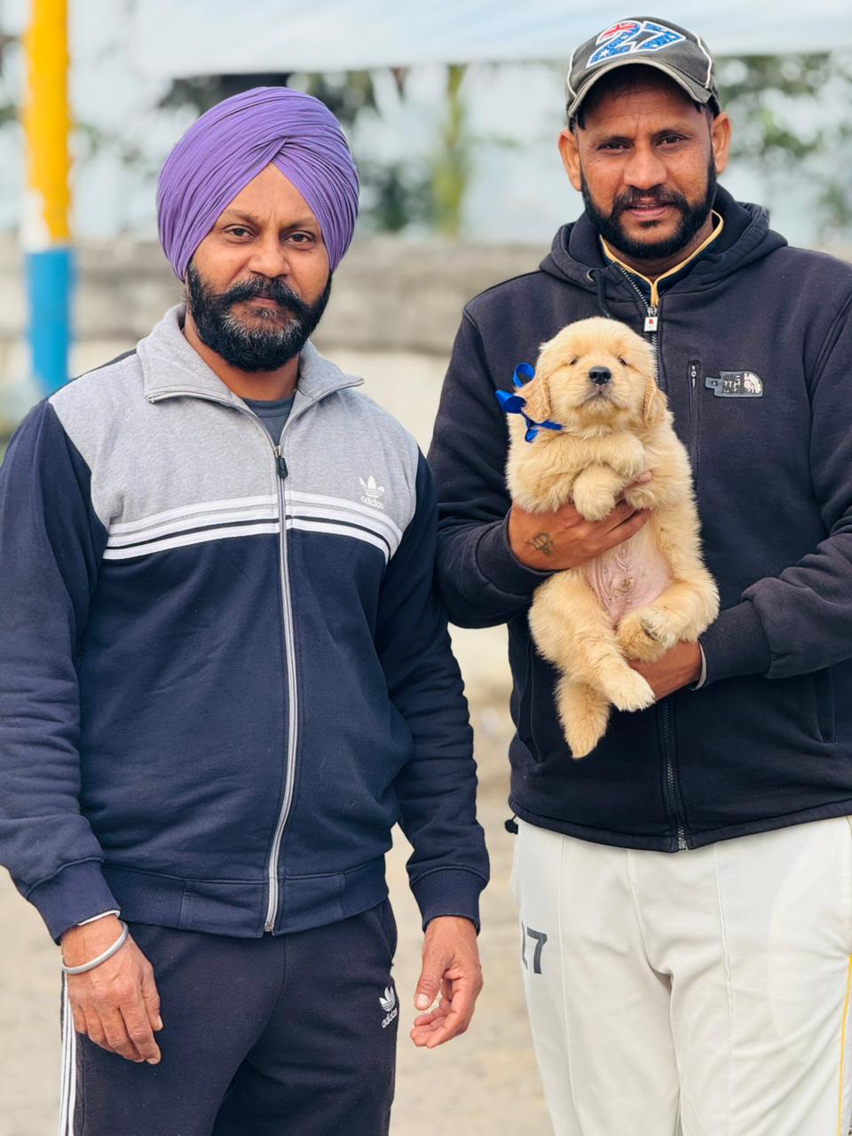 Customer holding purebred puppy from Kharoud Kennel