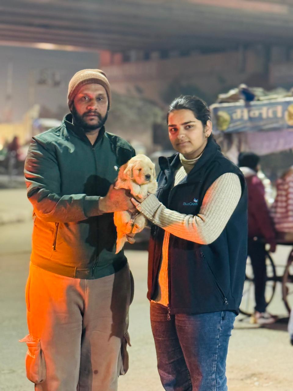 Happy pet owner with purebred puppy in Punjab