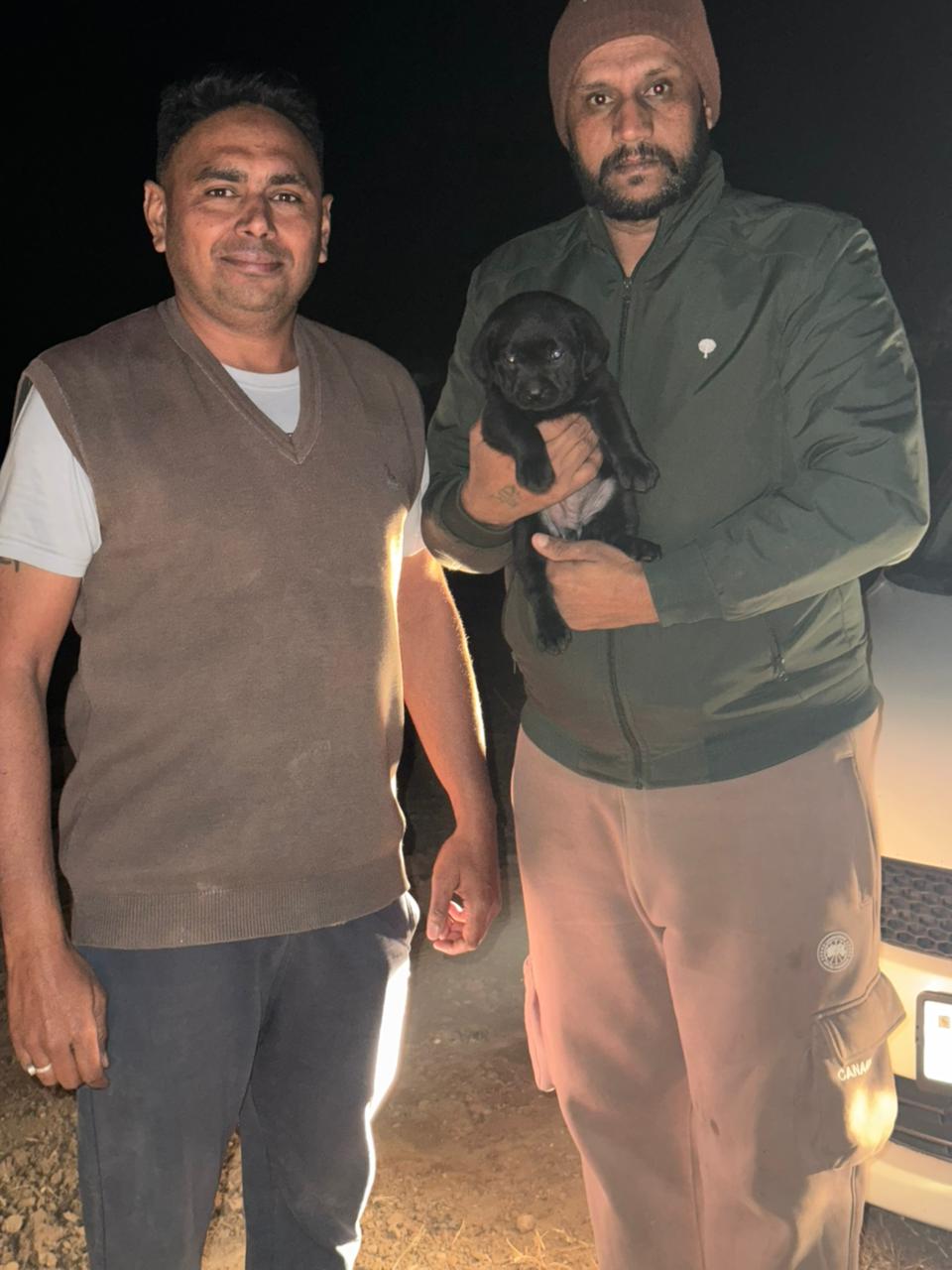 Customer receiving healthy puppy from Kharoud Kennel